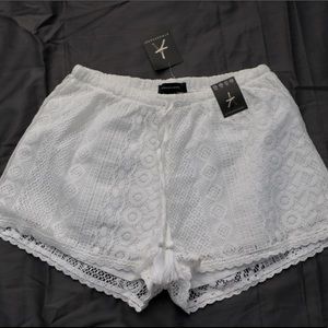 White Lace Shorts with Tassels